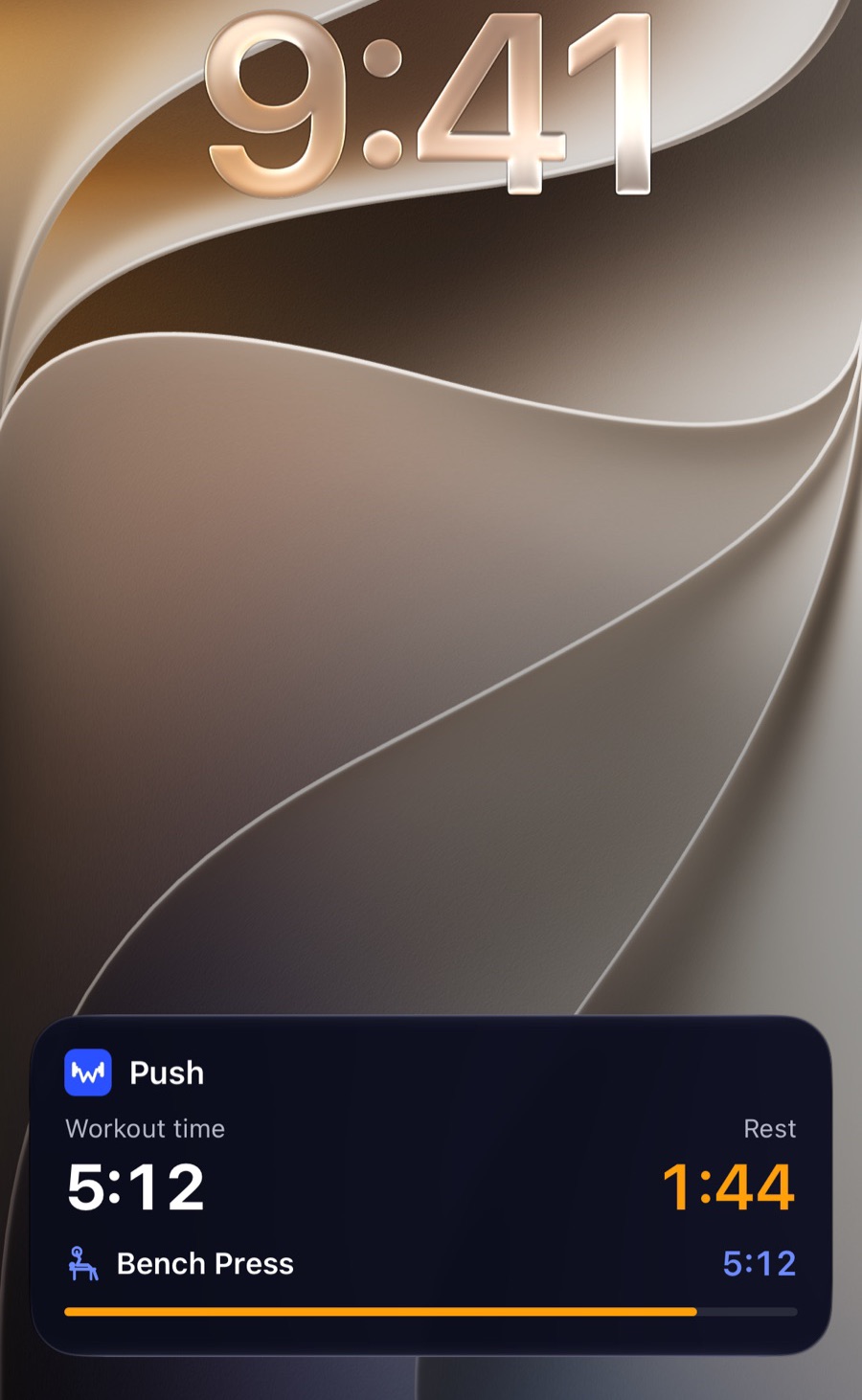 iPhone Lock Screen with W-orkout: workout name, workout time, orange rest countdown and the current exercise with its own clock
